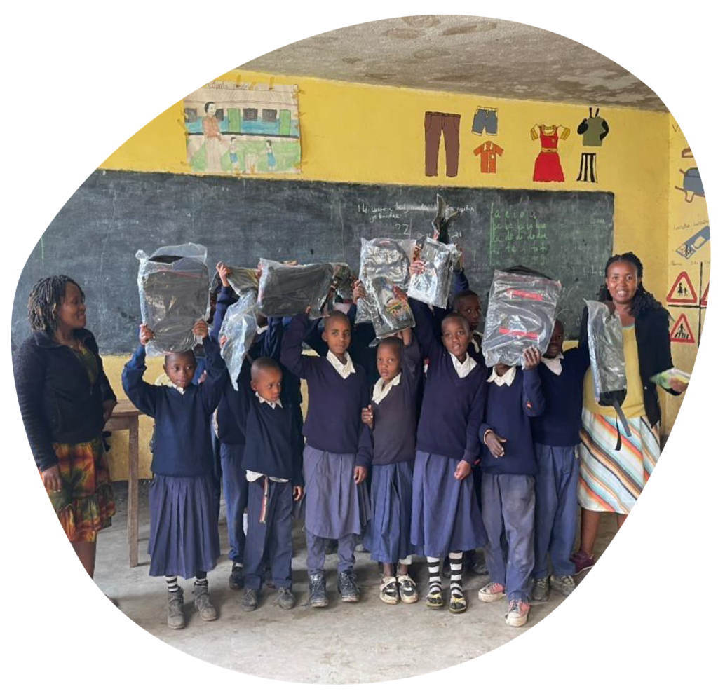 Happy Arusha School children holding new school uniforms